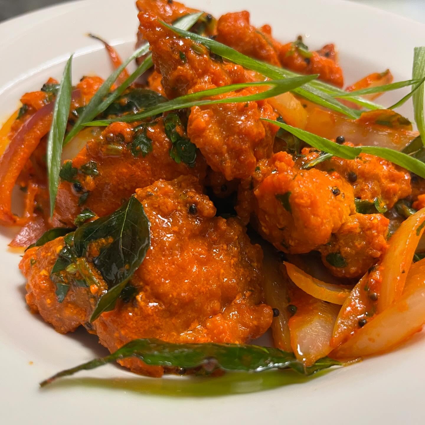 Spicy and crispy fried chicken pieces, marinated in a blend of South Indian spices.