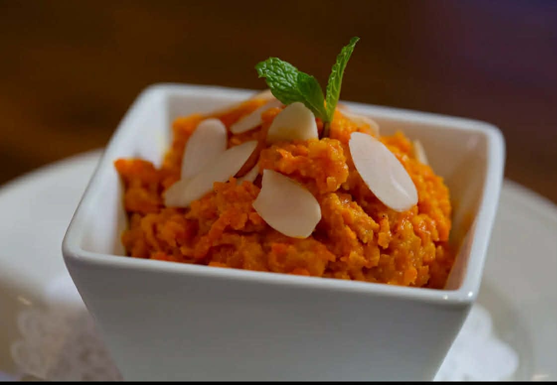 Nepalese style sweet dessert made from carrot, milk, ghee and cardamom powder.